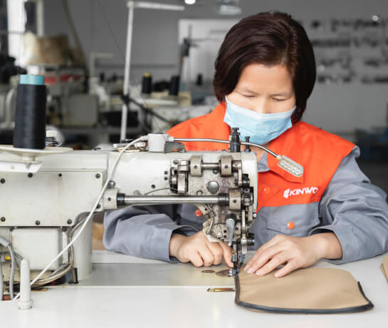 Woman fabricator making custom bags