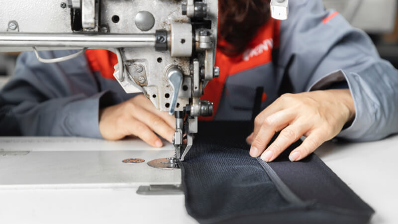 Worker making custom bags