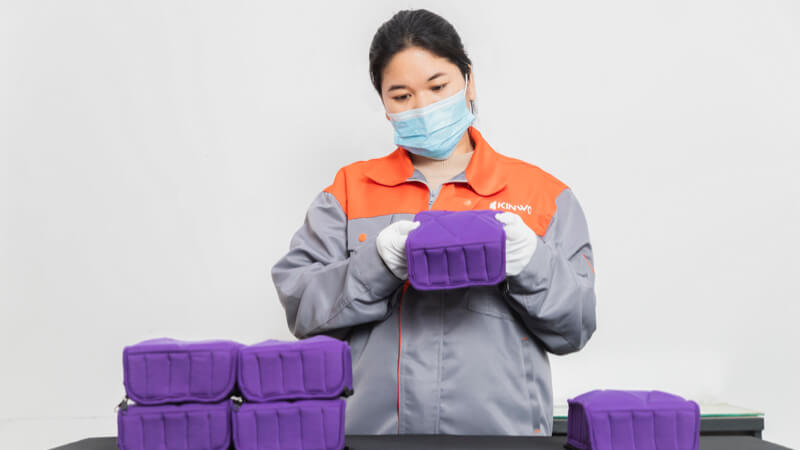 Cutom bag fabricator checking raw materials