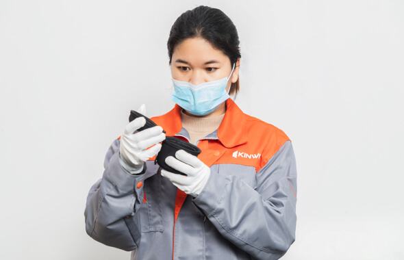 Fabricator inspecting details of custom bags