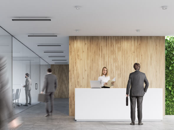 Receptionist receiving a client